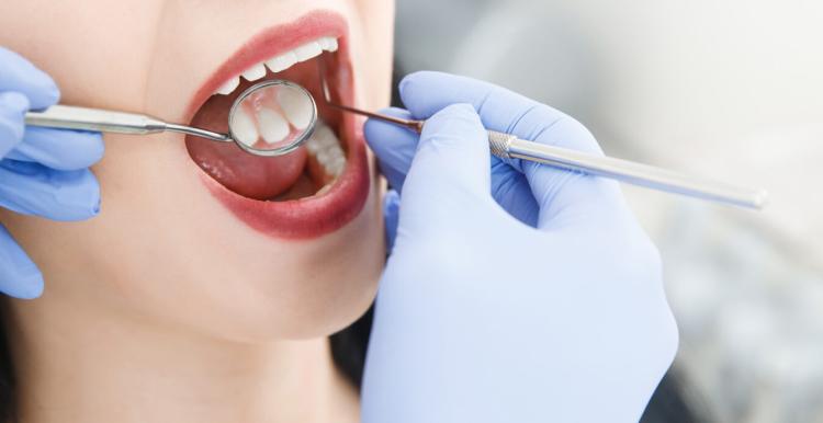 Dental patient having their teeth checked
